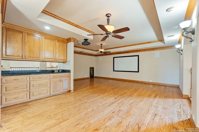 a kitchen with stainless steel appliances granite countertop a sink and cabinets