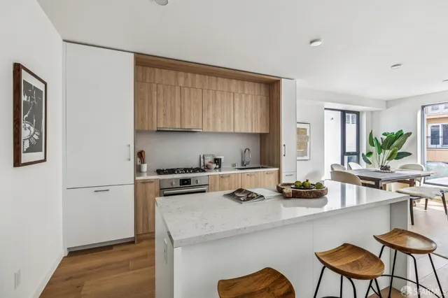 a kitchen with a sink cabinets and window
