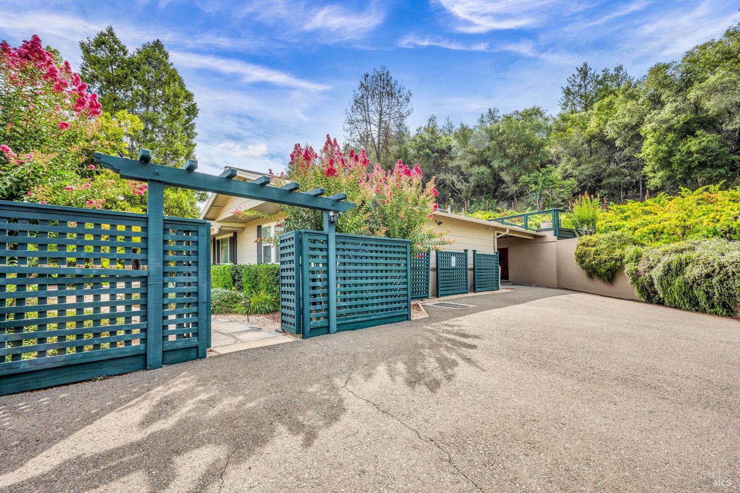 1389 Canyon Road Geyserville, CA 95441 - Photo 56 of 59 a front view of a house with a yard and a garage