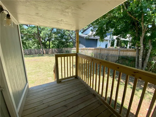 a view of balcony with wooden floor