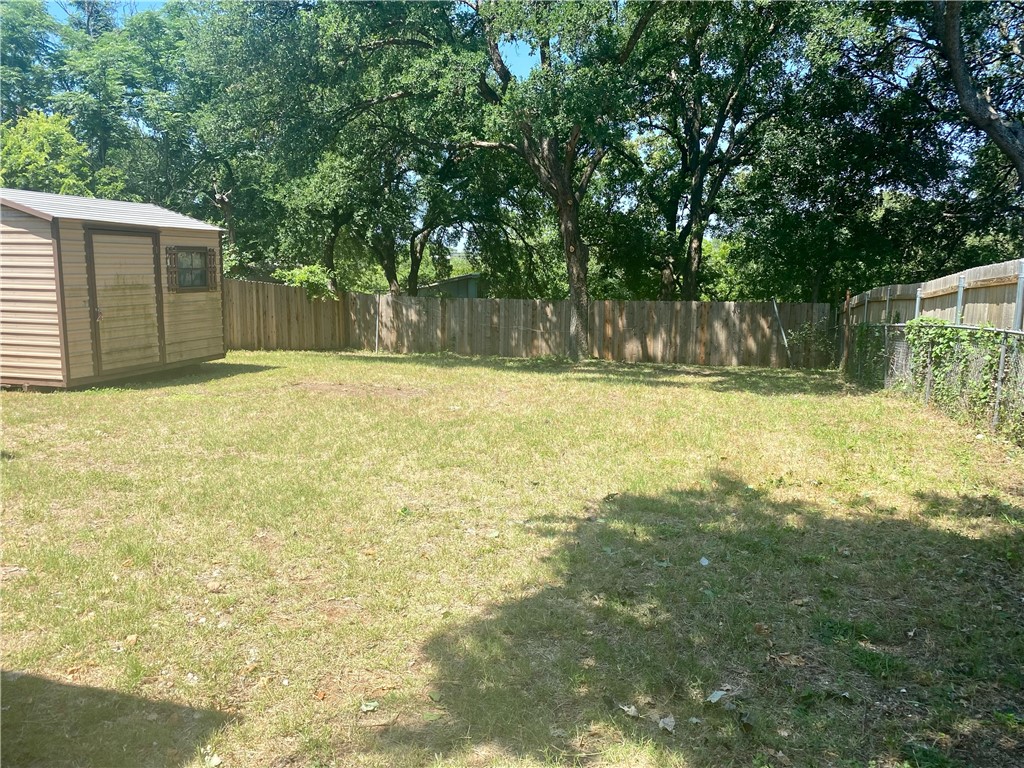 1306 Perez Street Austin, TX 78721 - Photo 16 of 17 a view of a yard with a large tree