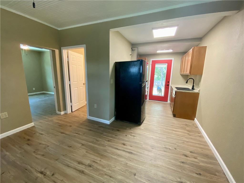 1306 Perez Street Austin, TX 78721 - Photo 6 of 17 a view of a livingroom with wooden floor and staircase