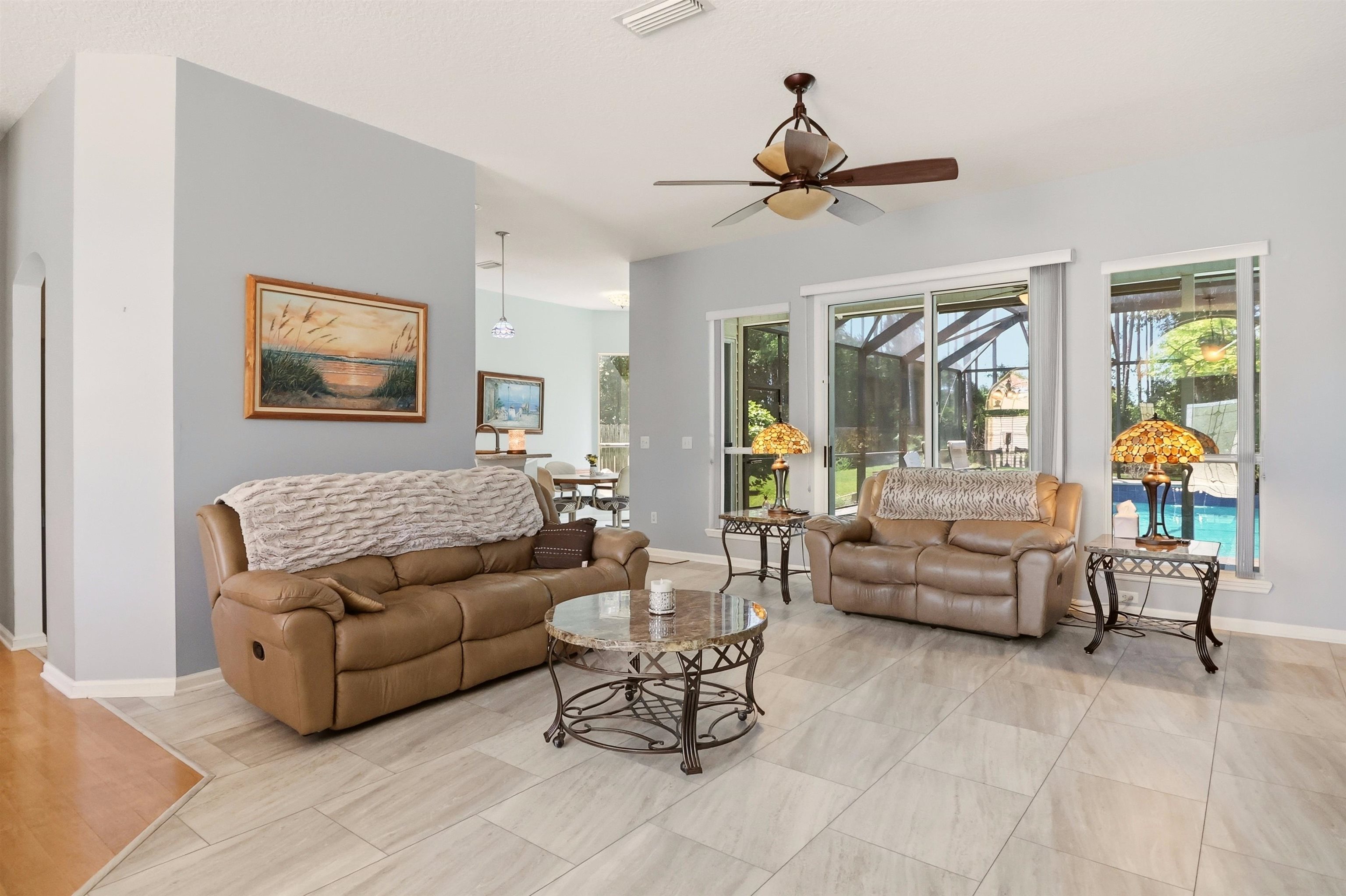 273 Whisper Ridge Drive St. Augustine, FL 32092 - Photo 11 of 44 Living area with baseboards and ceiling fan