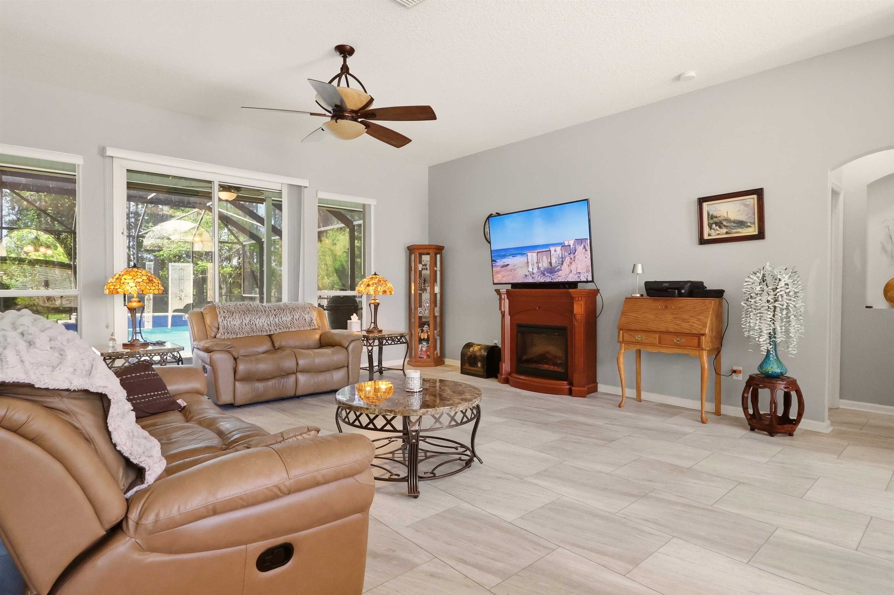 273 Whisper Ridge Drive St. Augustine, FL 32092 - Photo 12 of 44 Living area featuring arched walkways, ceiling fan