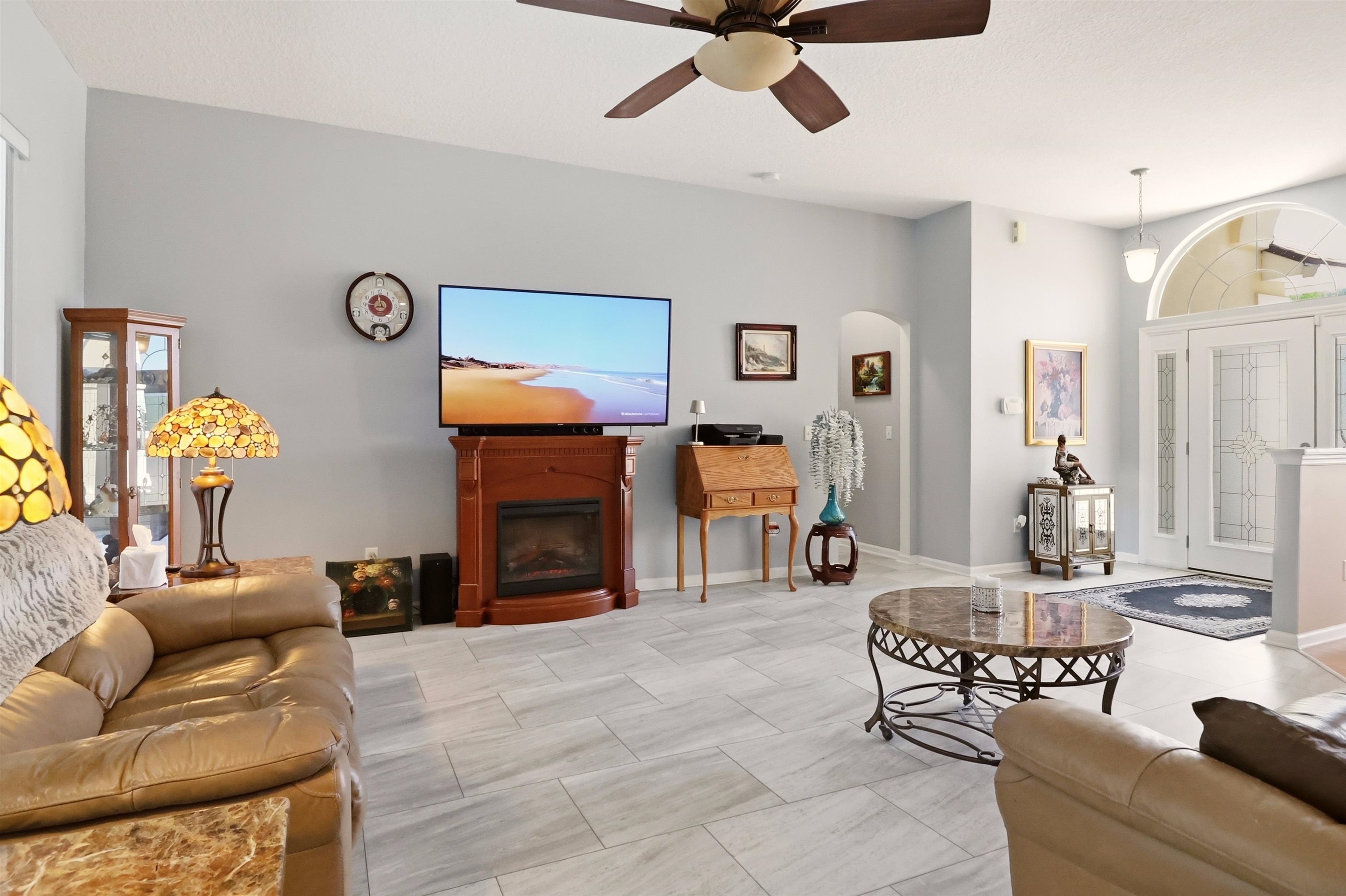 273 Whisper Ridge Drive St. Augustine, FL 32092 - Photo 13 of 44 Living area with a ceiling fan, and arched walkways