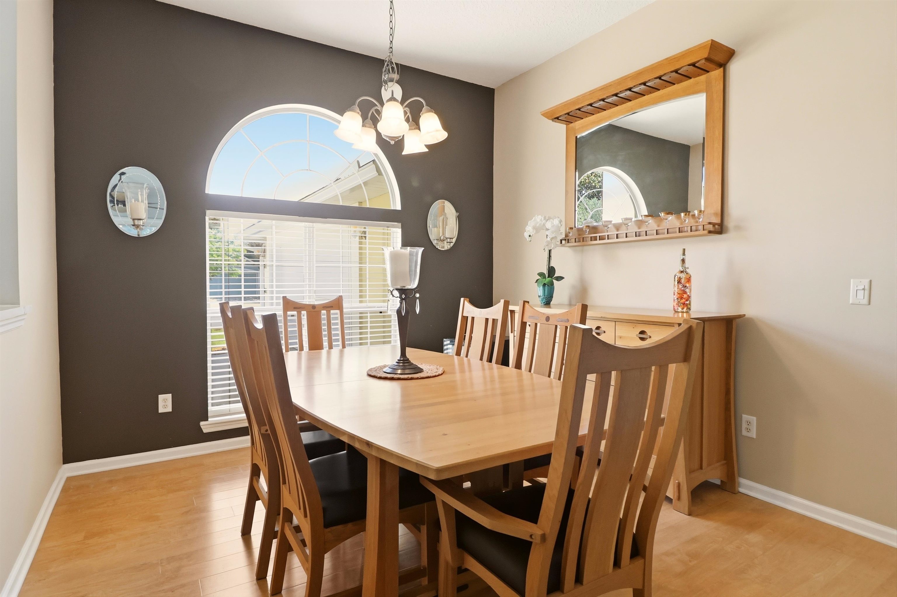 273 Whisper Ridge Drive St. Augustine, FL 32092 - Photo 15 of 44 Dining room featuring suspended lighting and light wood-style floors
