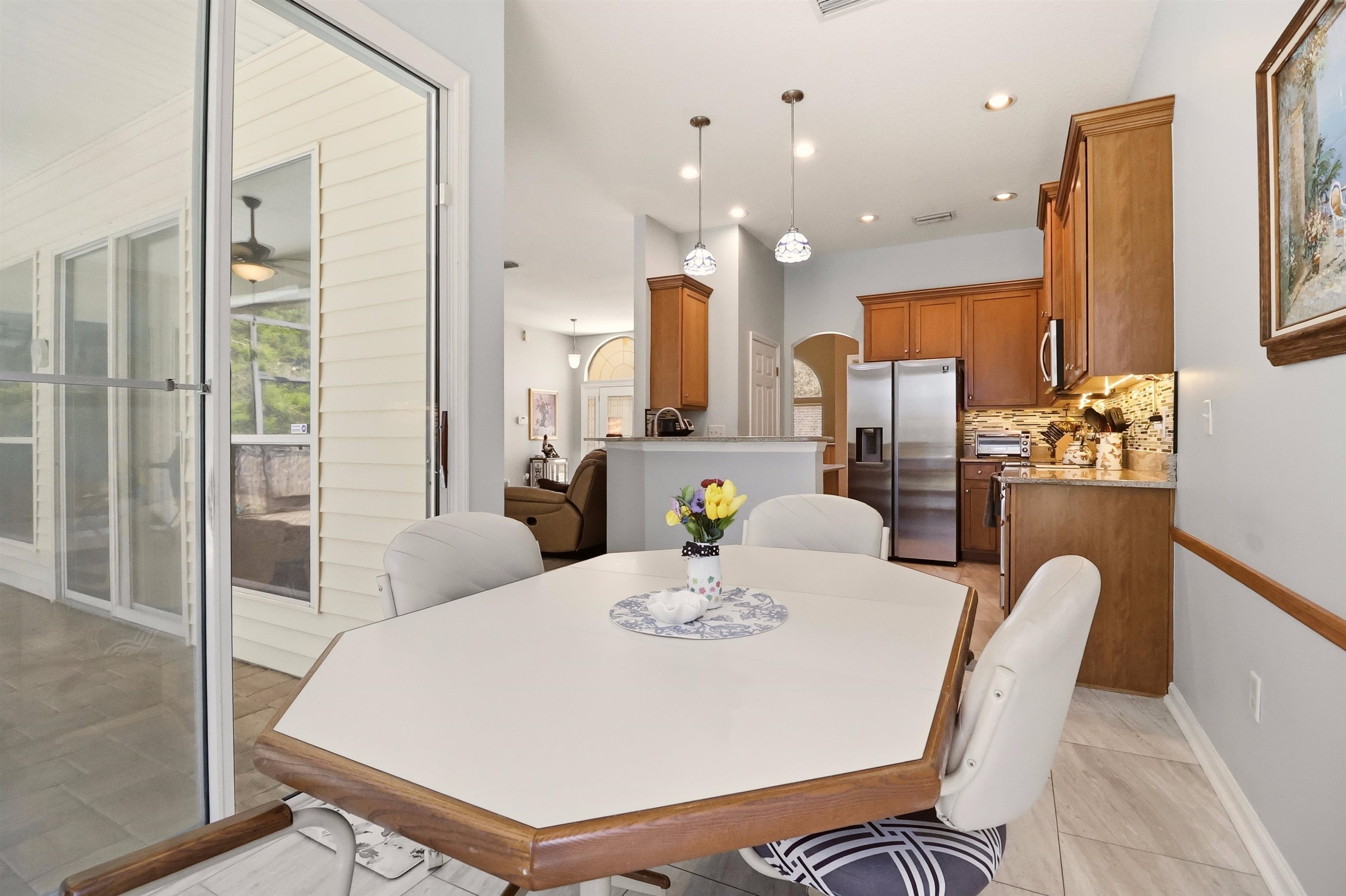 273 Whisper Ridge Drive St. Augustine, FL 32092 - Photo 21 of 44 Dining space with recessed lighting, arched walkways, and ceiling fan