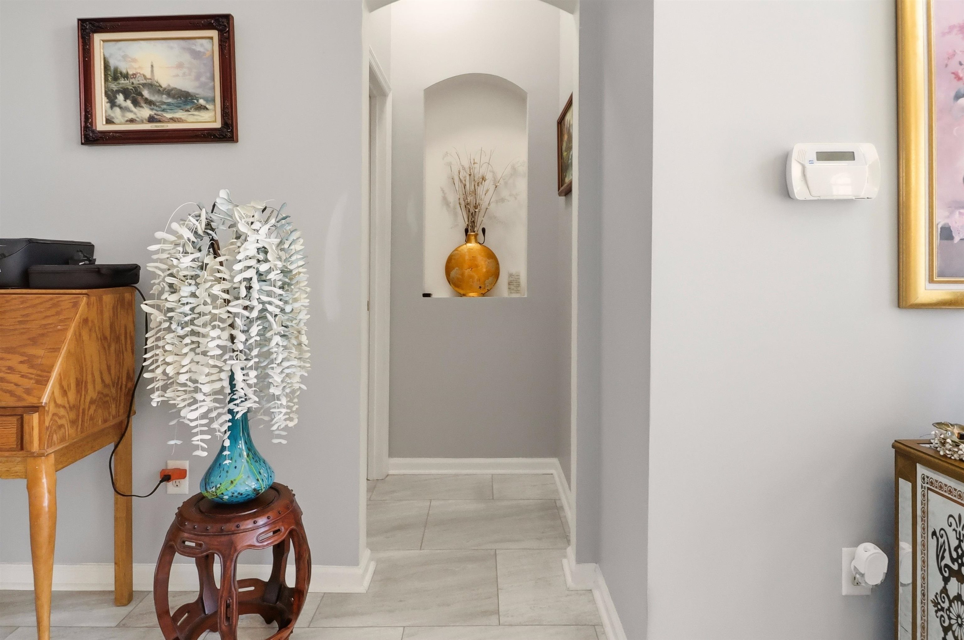 273 Whisper Ridge Drive St. Augustine, FL 32092 - Photo 22 of 44 Hall featuring baseboards and arched walkways