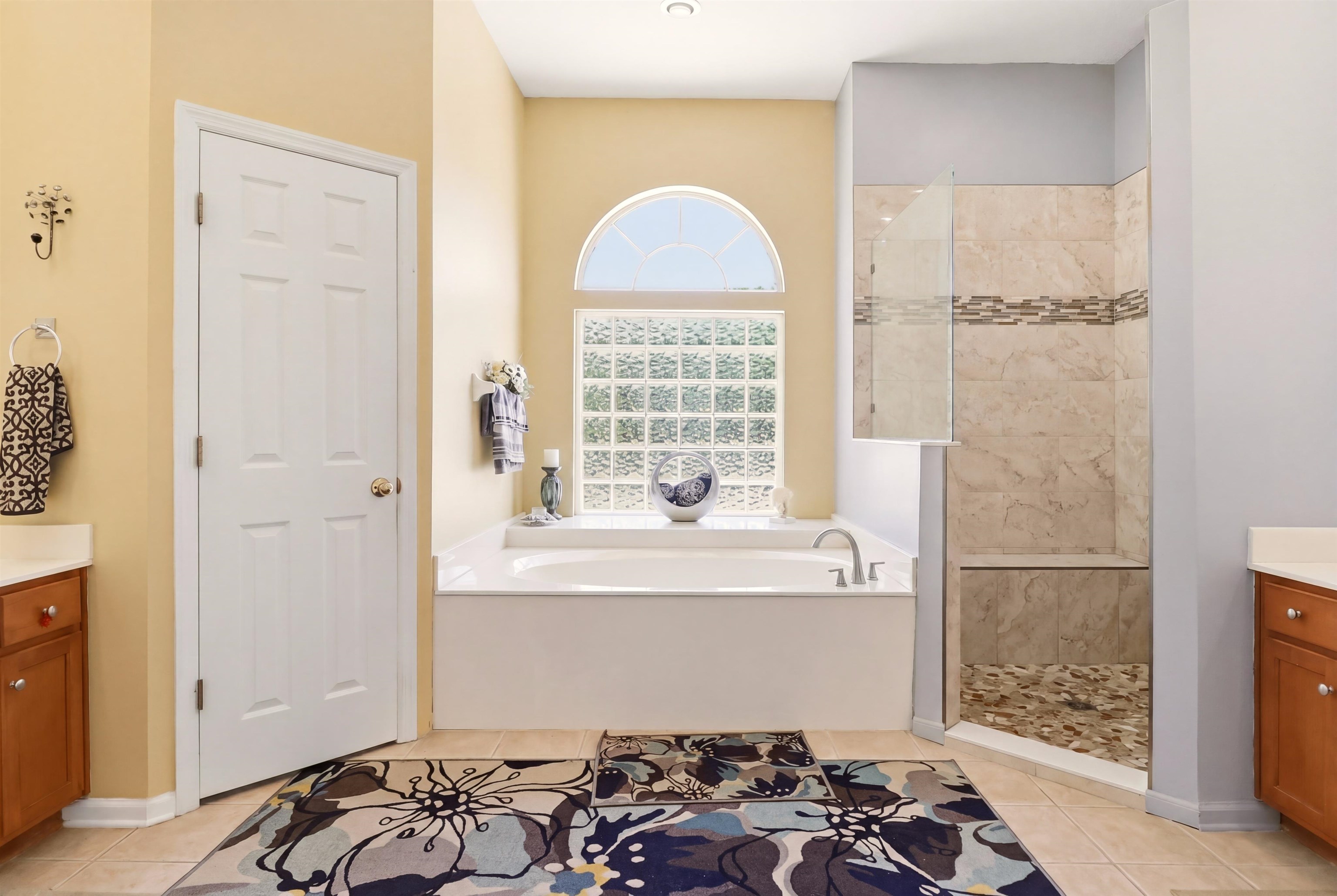 273 Whisper Ridge Drive St. Augustine, FL 32092 - Photo 27 of 44 Full bathroom with vanity, walk in shower, a bath, and light tile patterned floors