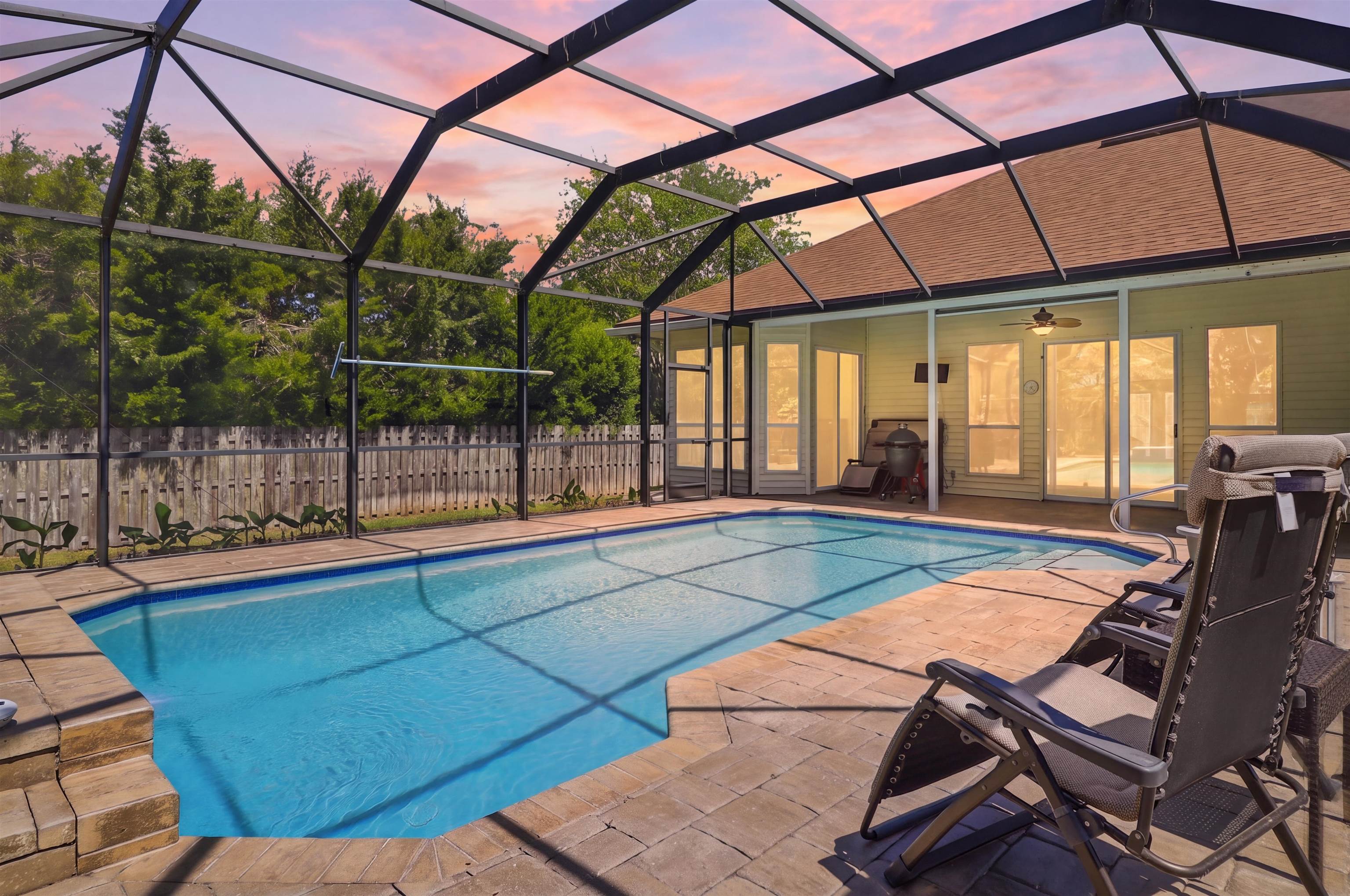 273 Whisper Ridge Drive St. Augustine, FL 32092 - Photo 3 of 44 View of pool featuring paver patio and screen enclosure