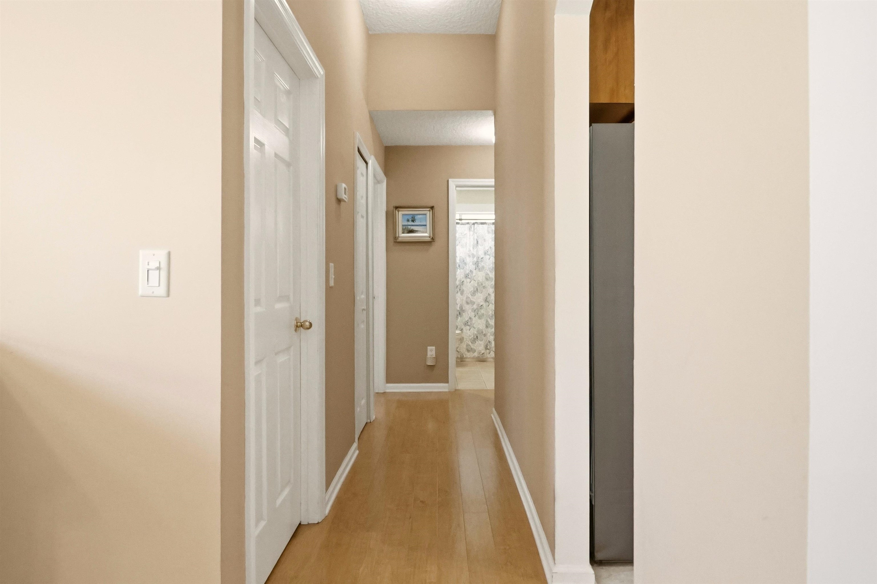 273 Whisper Ridge Drive St. Augustine, FL 32092 - Photo 33 of 44 Hallway with light wood-style floors and baseboards