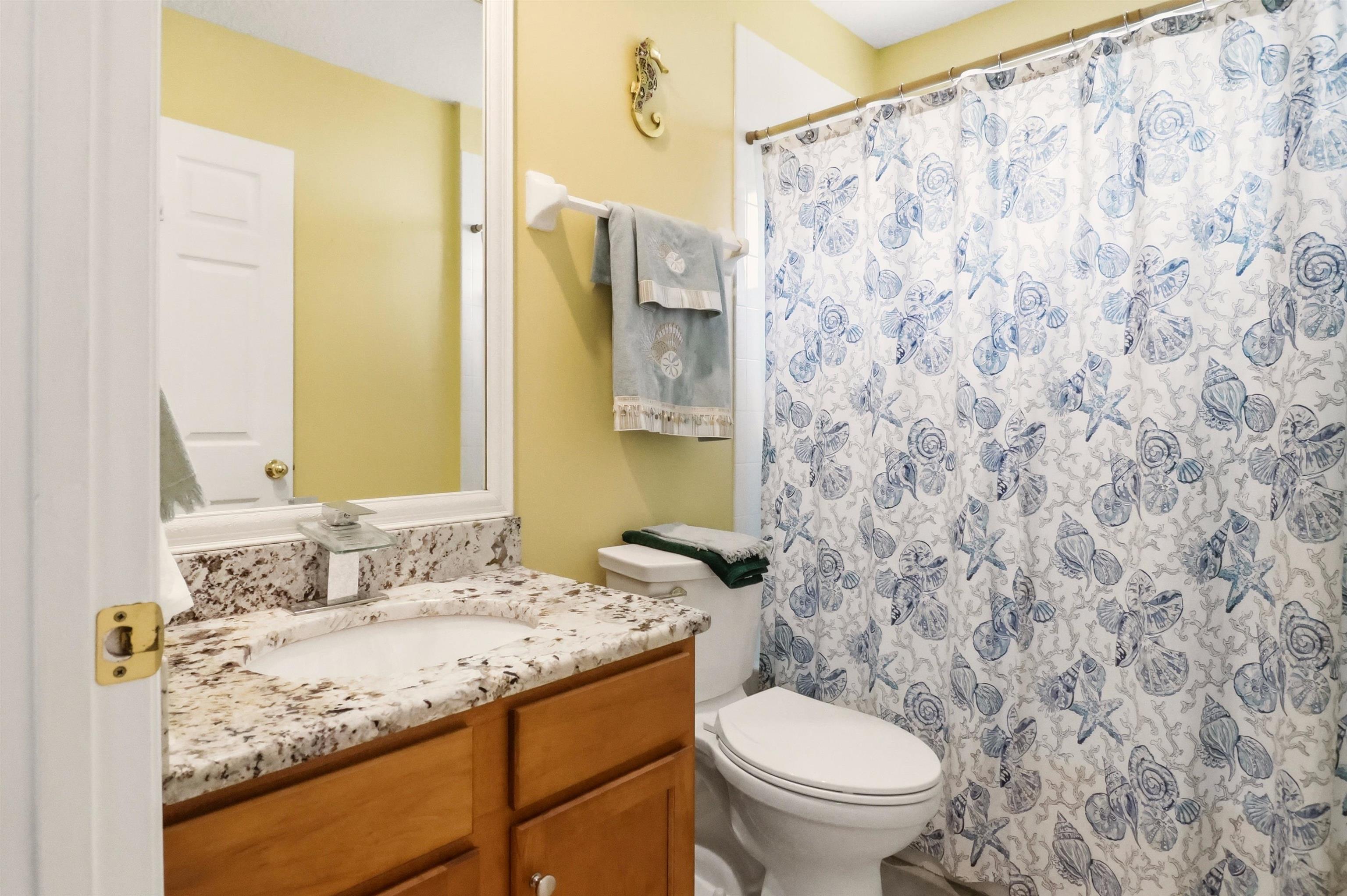 273 Whisper Ridge Drive St. Augustine, FL 32092 - Photo 36 of 44 Bathroom featuring vanity and curtained shower