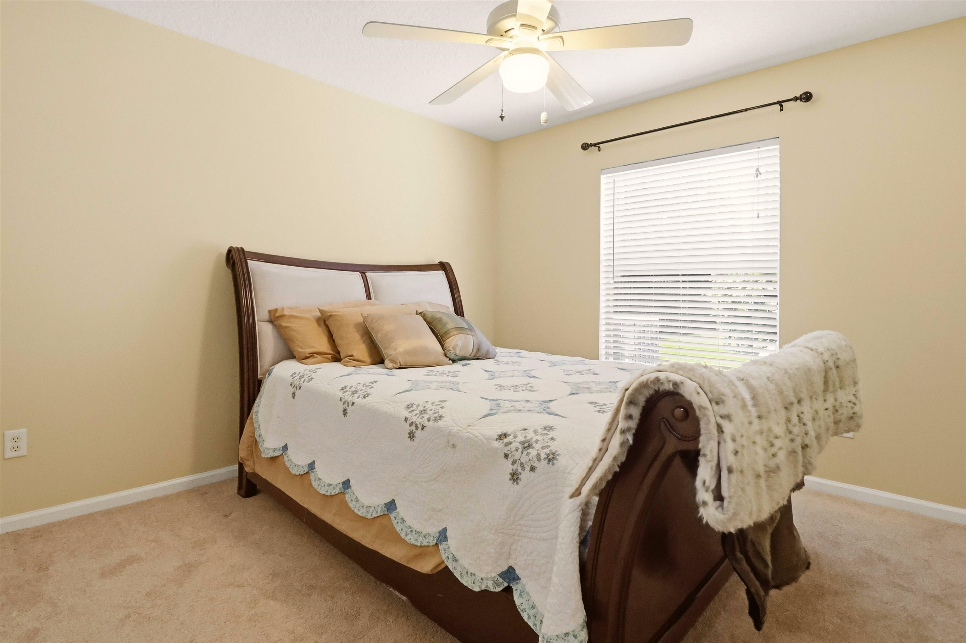 273 Whisper Ridge Drive St. Augustine, FL 32092 - Photo 37 of 44 Bedroom featuring ceiling fan and light colored carpet