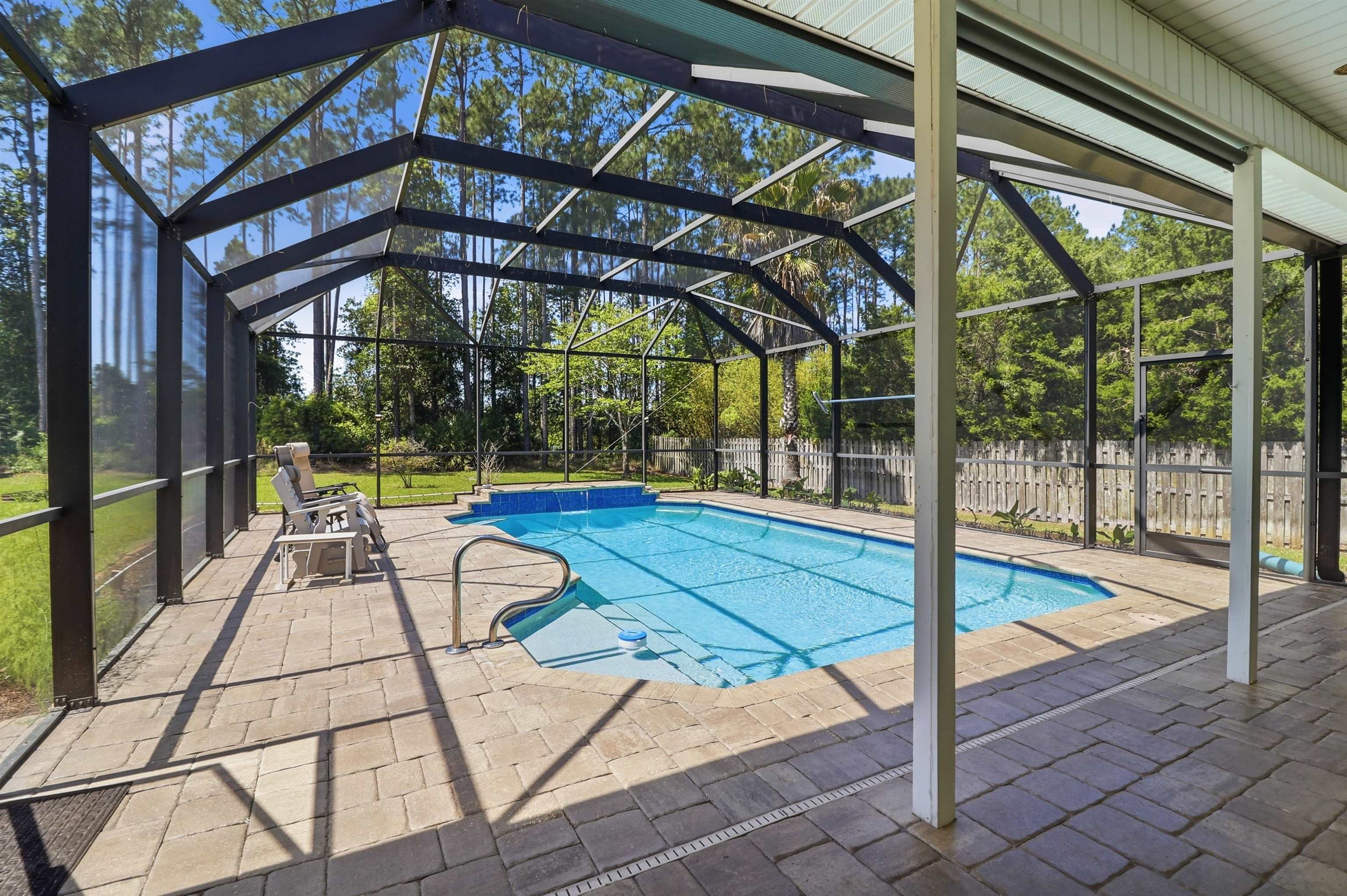 273 Whisper Ridge Drive St. Augustine, FL 32092 - Photo 41 of 44 View of pool featuring patio surround, a lanai, and a sunroom
