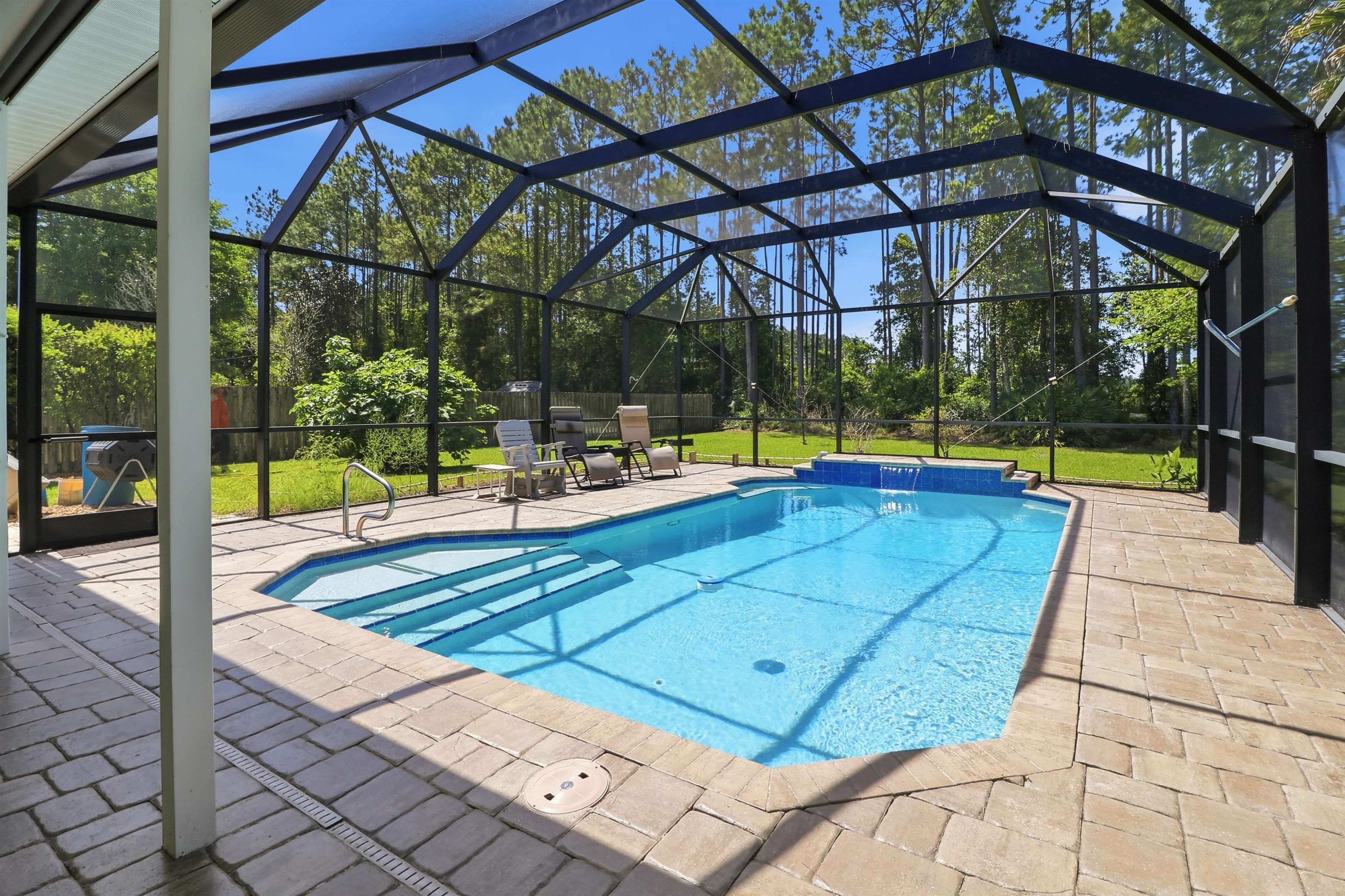 273 Whisper Ridge Drive St. Augustine, FL 32092 - Photo 42 of 44 Swimming pool featuring a patio, a sunroom, and screened enclosure
