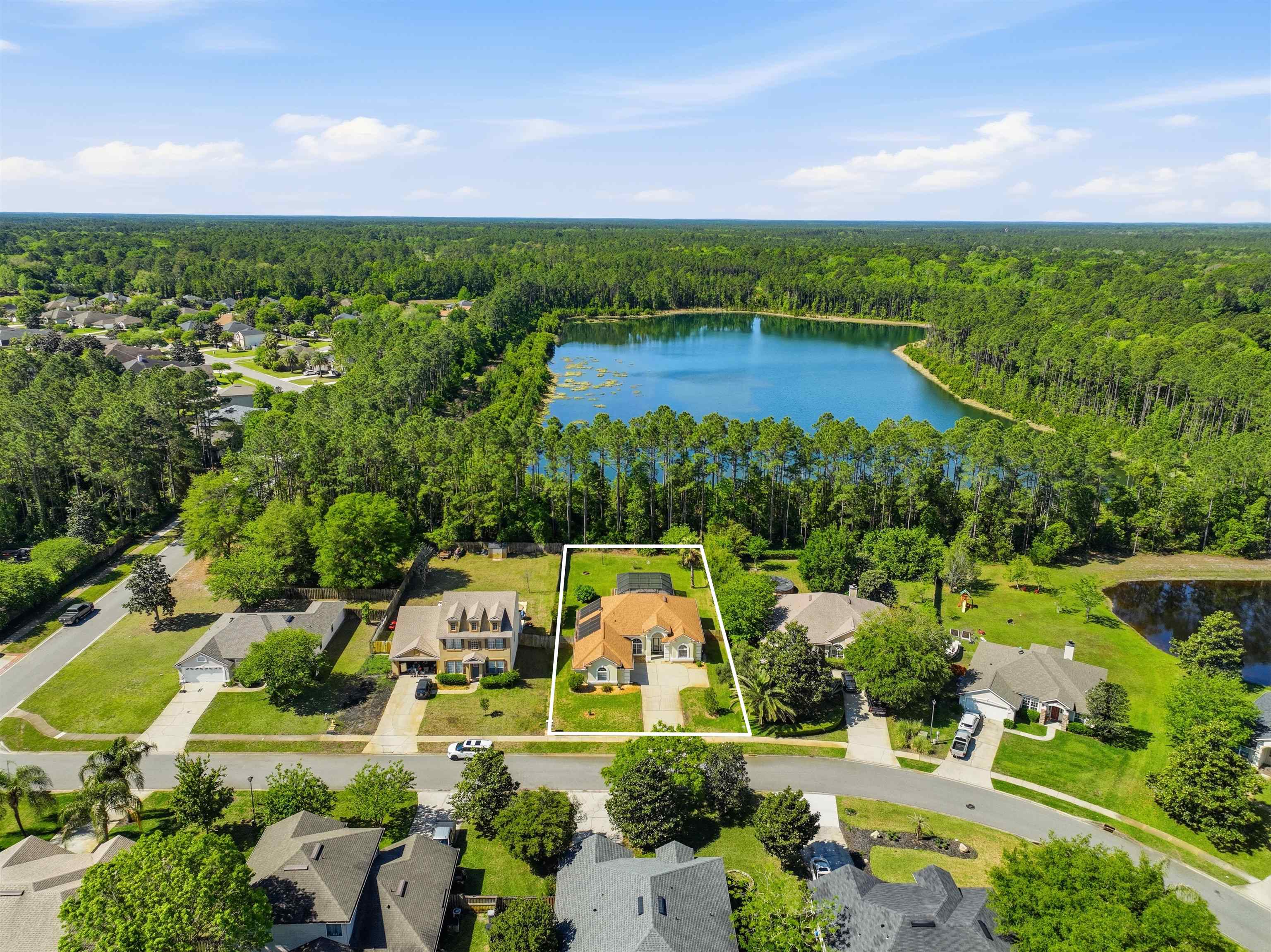 273 Whisper Ridge Drive St. Augustine, FL 32092 - Photo 5 of 44 Aerial perspective of suburban area with lake views