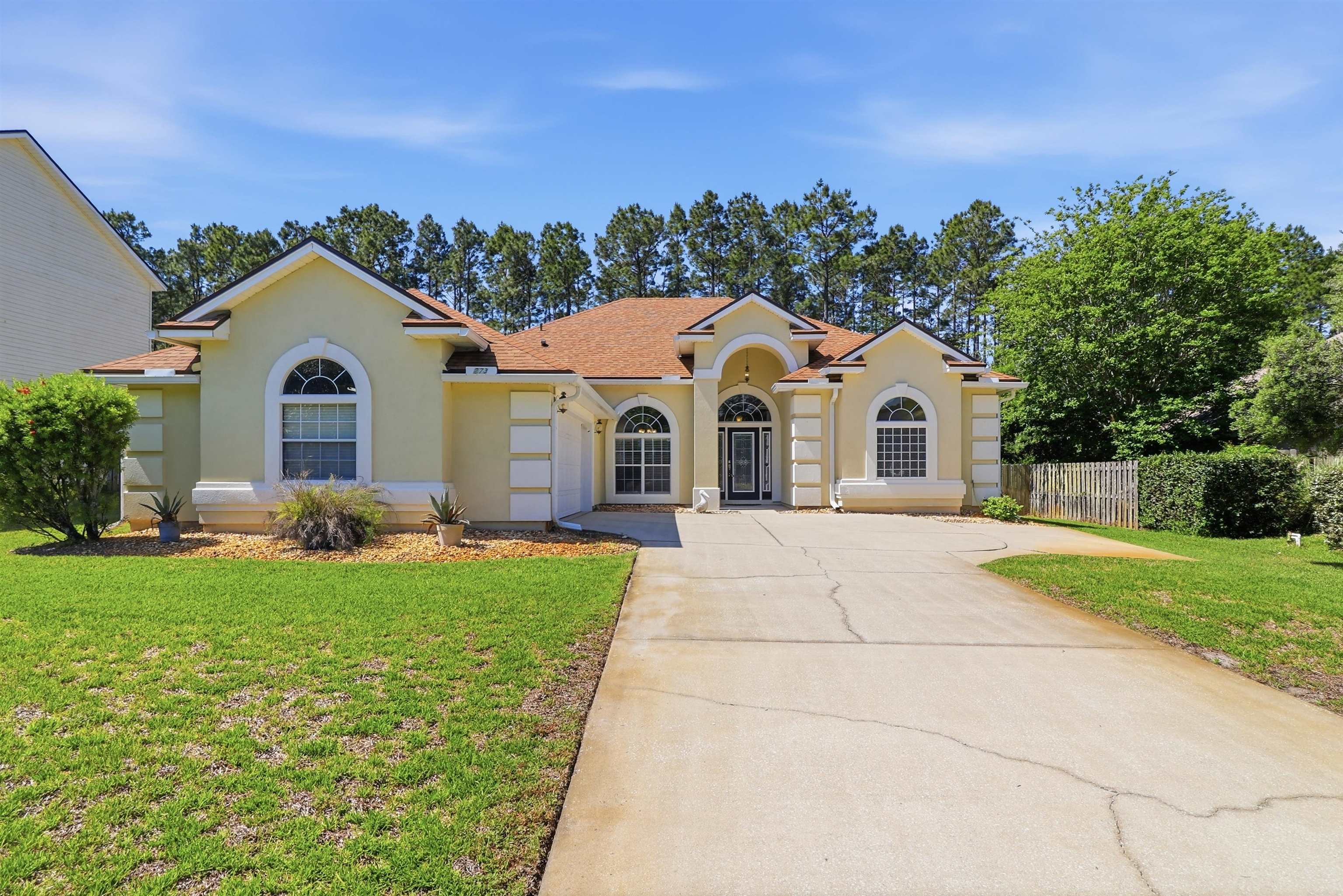 273 Whisper Ridge Drive St. Augustine, FL 32092 - Photo 8 of 44 Mediterranean / spanish house featuring stucco siding, concrete driveway, and roof with shingles