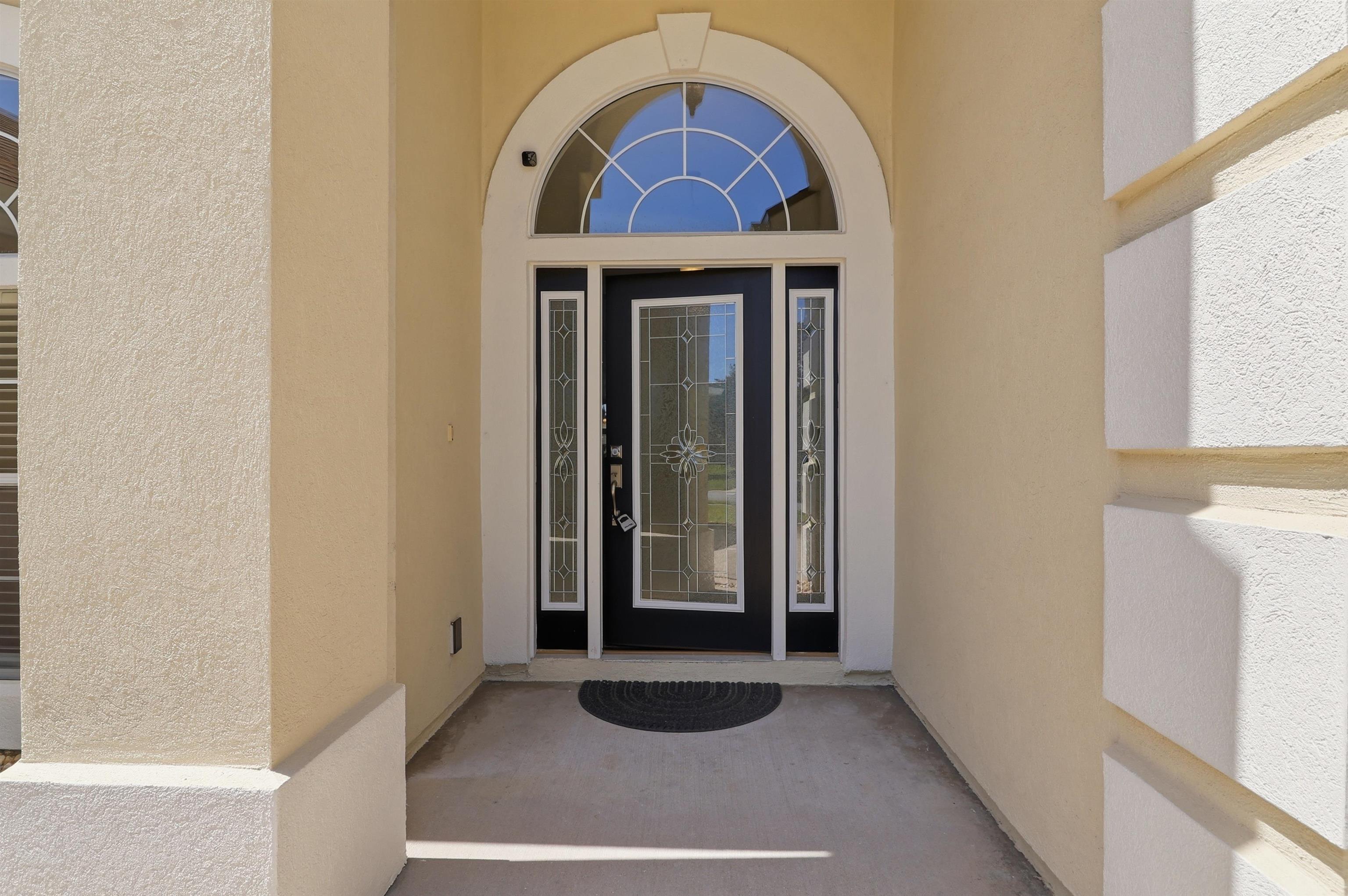273 Whisper Ridge Drive St. Augustine, FL 32092 - Photo 9 of 44 Property entrance featuring stucco siding