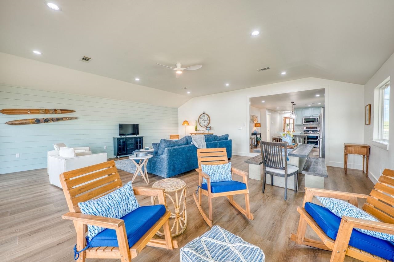 569 Ellen Williams Loop Kingsland, TX 78639 - Photo 16 of 29 a living room with furniture a rug and kitchen view