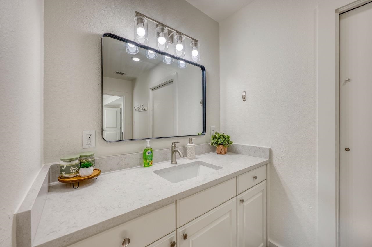 569 Ellen Williams Loop Kingsland, TX 78639 - Photo 21 of 29 a bathroom with a sink and a mirror
