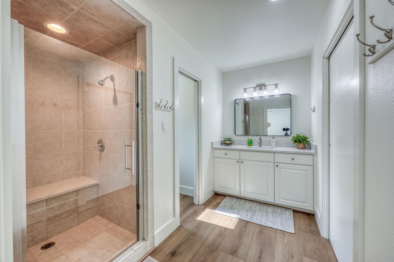 569 Ellen Williams Loop Kingsland, TX 78639 - Photo 22 of 29 a bathroom with a granite countertop sink mirror and shower