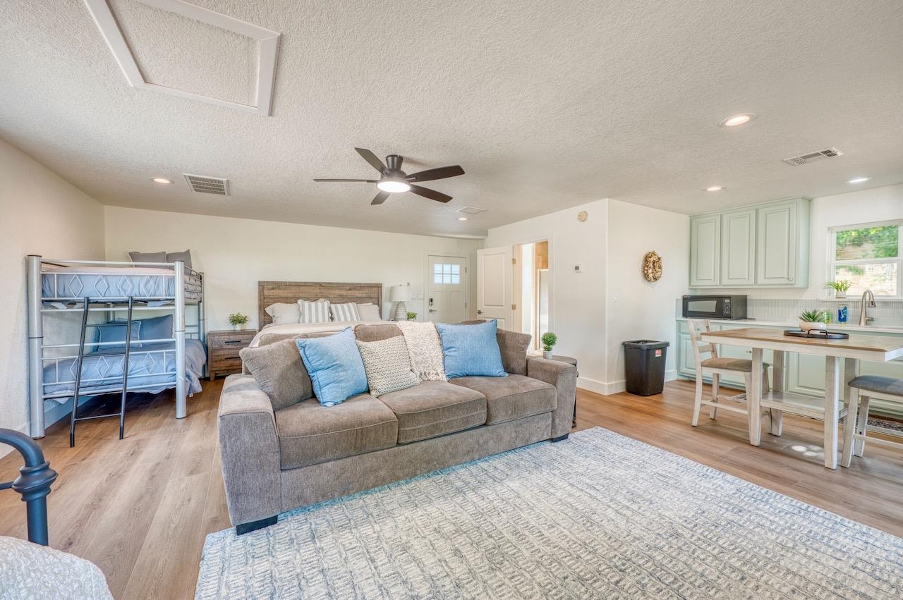 569 Ellen Williams Loop Kingsland, TX 78639 - Photo 27 of 29 a living room with furniture and a view of kitchen
