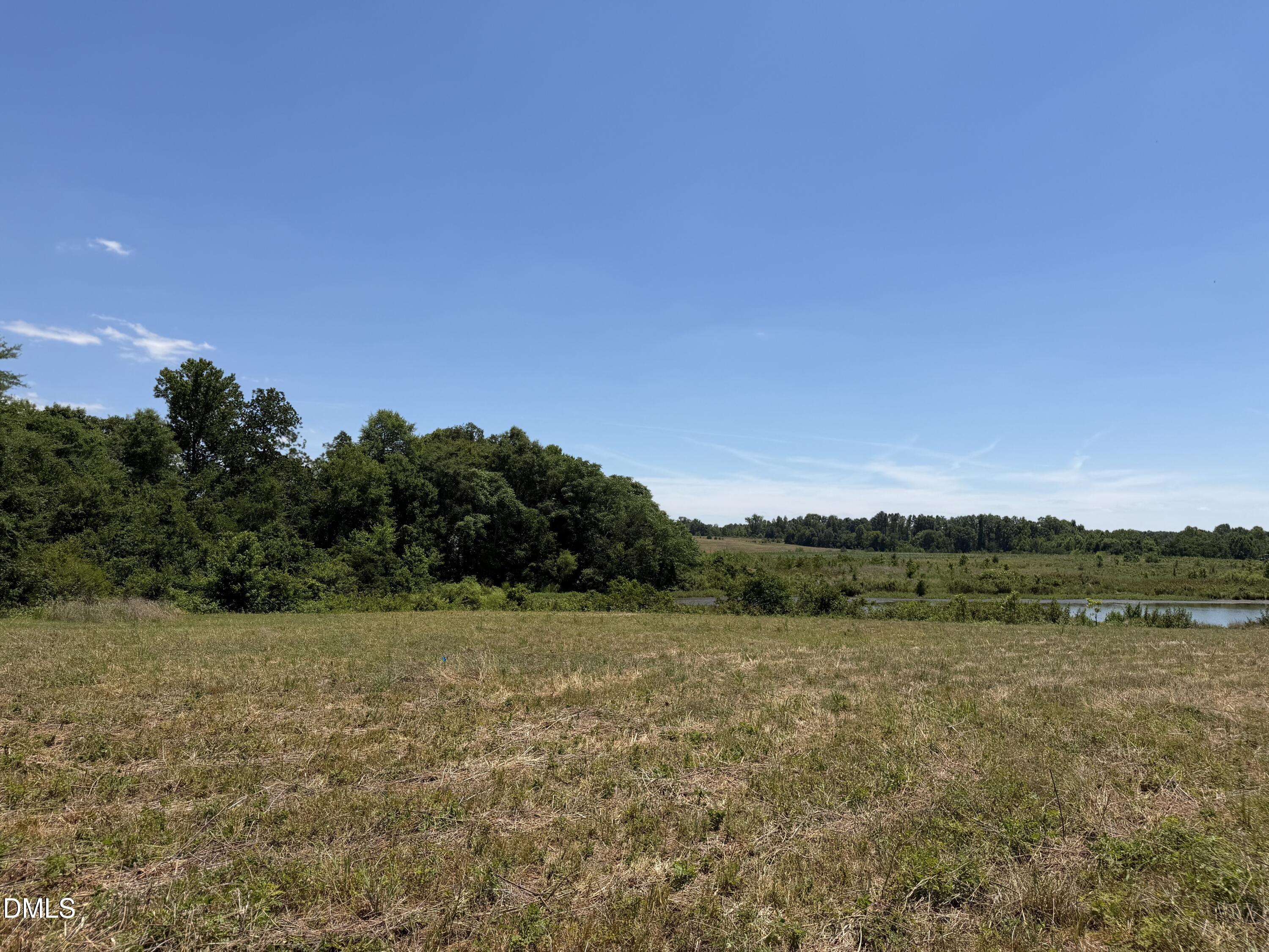 6020 Corbett Ridge Road Mebane, NC 27302 - Photo 11 of 20 a view of a lake with houses in the back