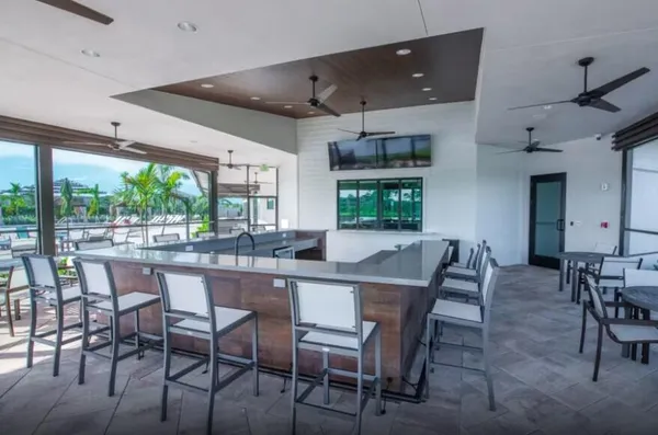 a dining area with a large window and table