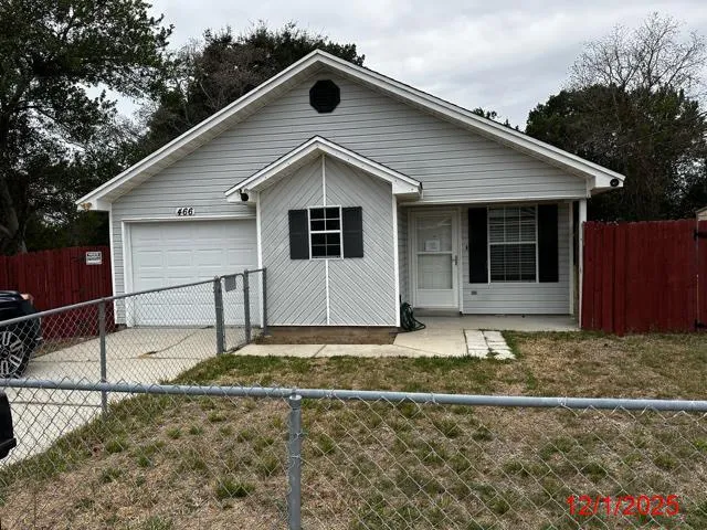 a house with trees in the background