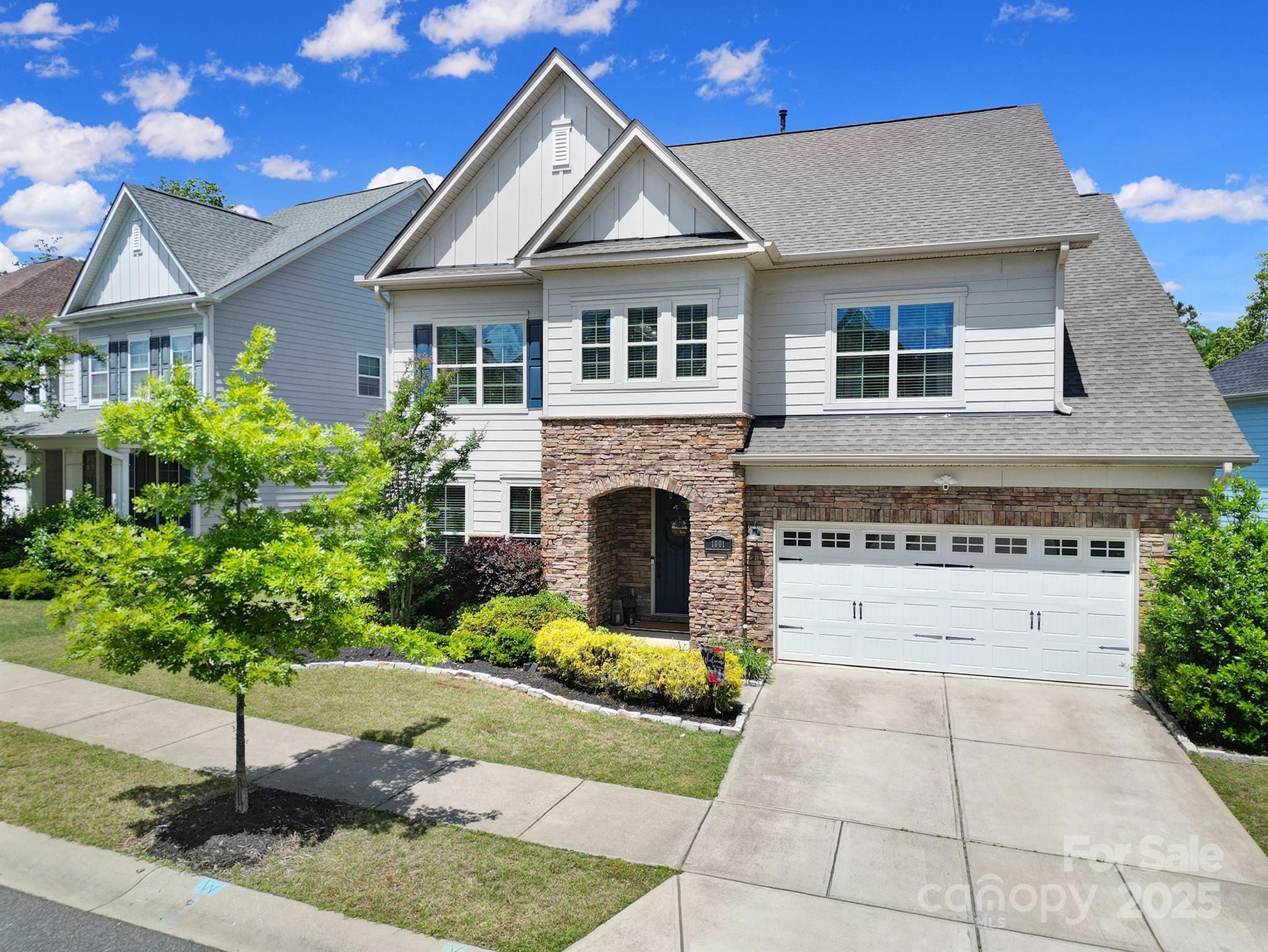 1001 Emory Lane Fort Mill, SC 29708 - Photo 3 of 45 a front view of a house with a garden