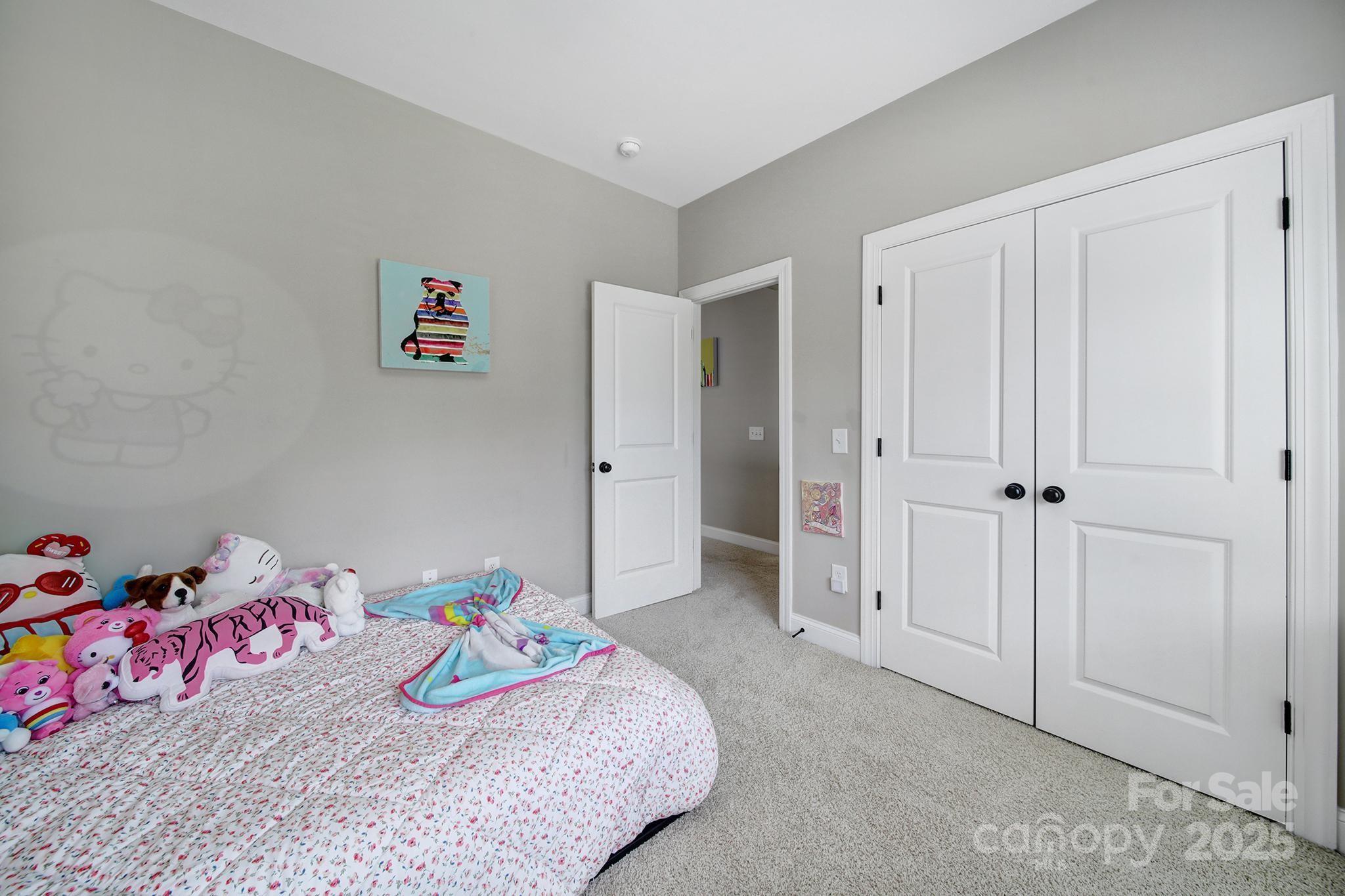 1001 Emory Lane Fort Mill, SC 29708 - Photo 32 of 45 a bedroom with a bed and hallway