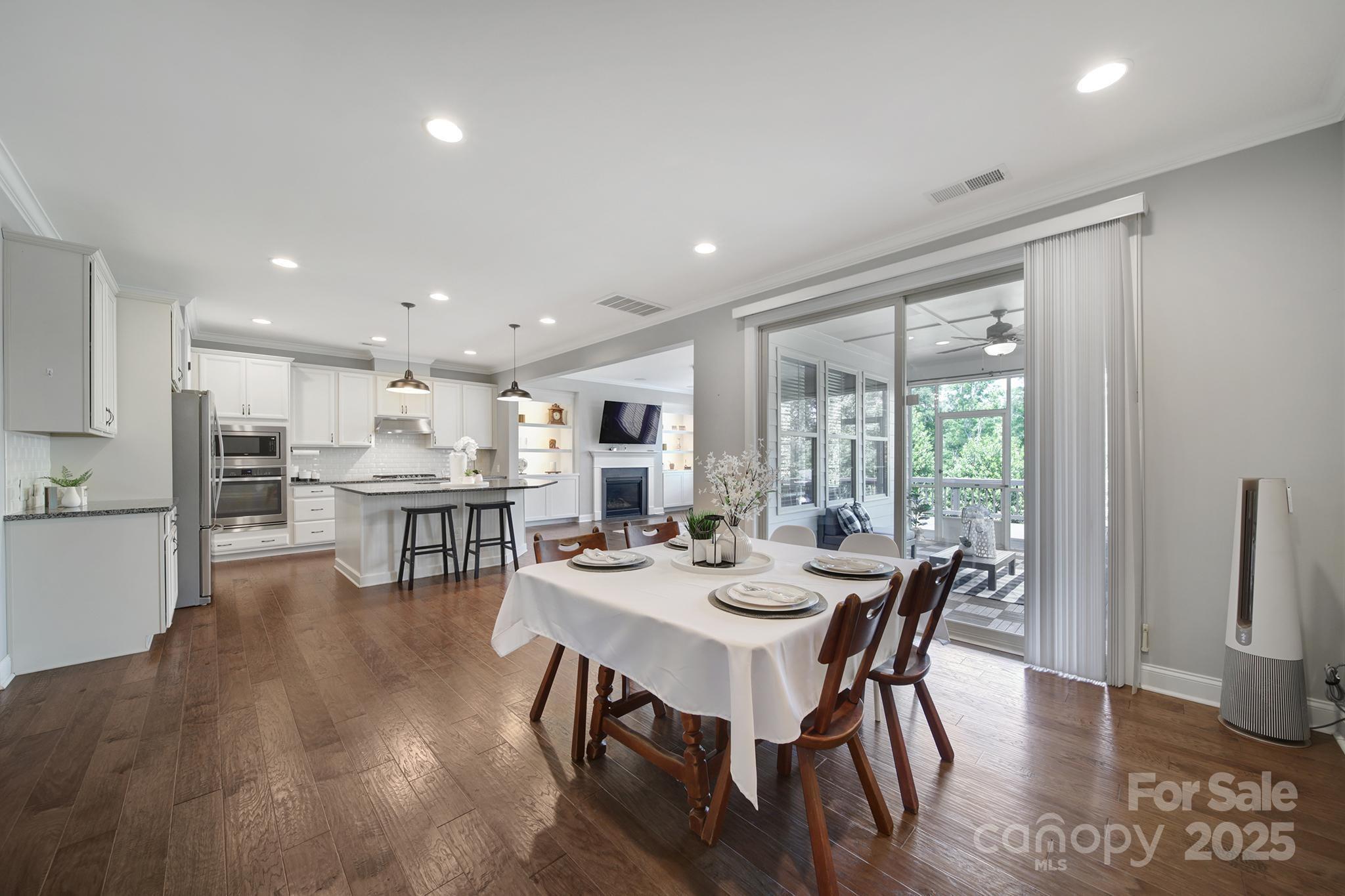 1001 Emory Lane Fort Mill, SC 29708 - Photo 9 of 45 a view of a dining room with furniture window and wooden floor