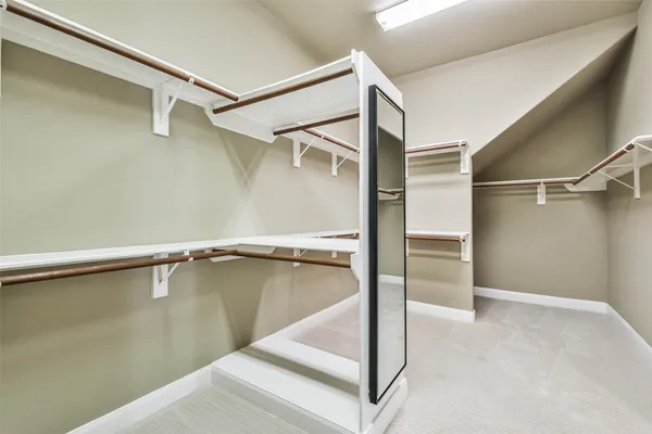 a view of an empty walk in closet