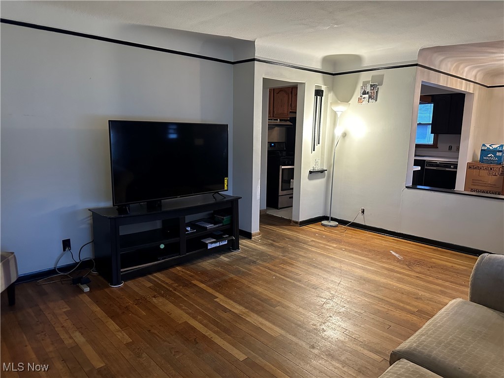 12303 Orme Road Garfield Heights, OH 44125 - Photo 5 of 22 Living room with hardwood / wood-style floors and baseboards