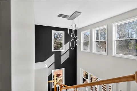 a view of an entryway with wooden floor