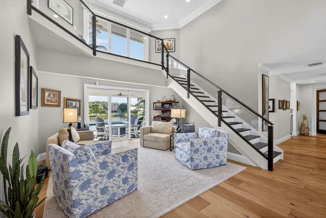 an aerial view of a houses with a swimming pool