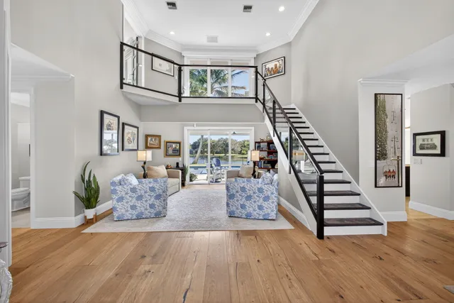 a bedroom with bed and a large window