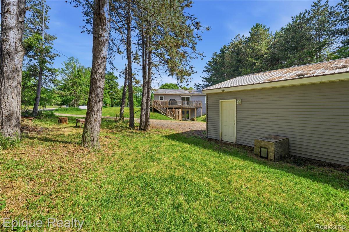 12272 East Mt Morris Road Davison, MI 48423 - Photo 33 of 39 Expansive green lawn with mature trees and visible outbuilding