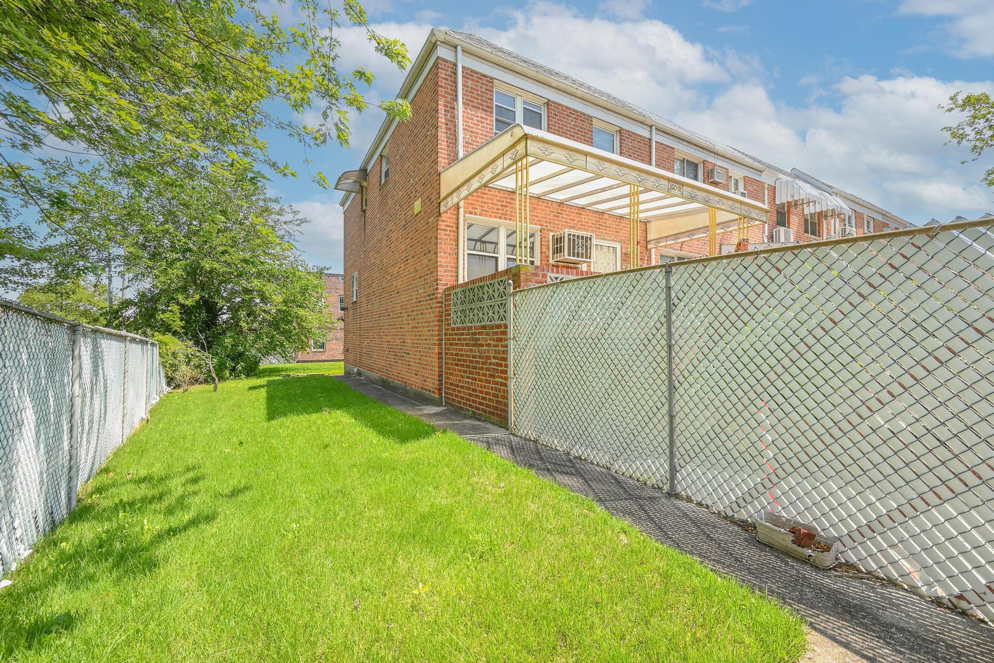 150-01 Horace Harding Expressway Queens, NY 11367 - Photo 4 of 17 View of property exterior featuring brick siding