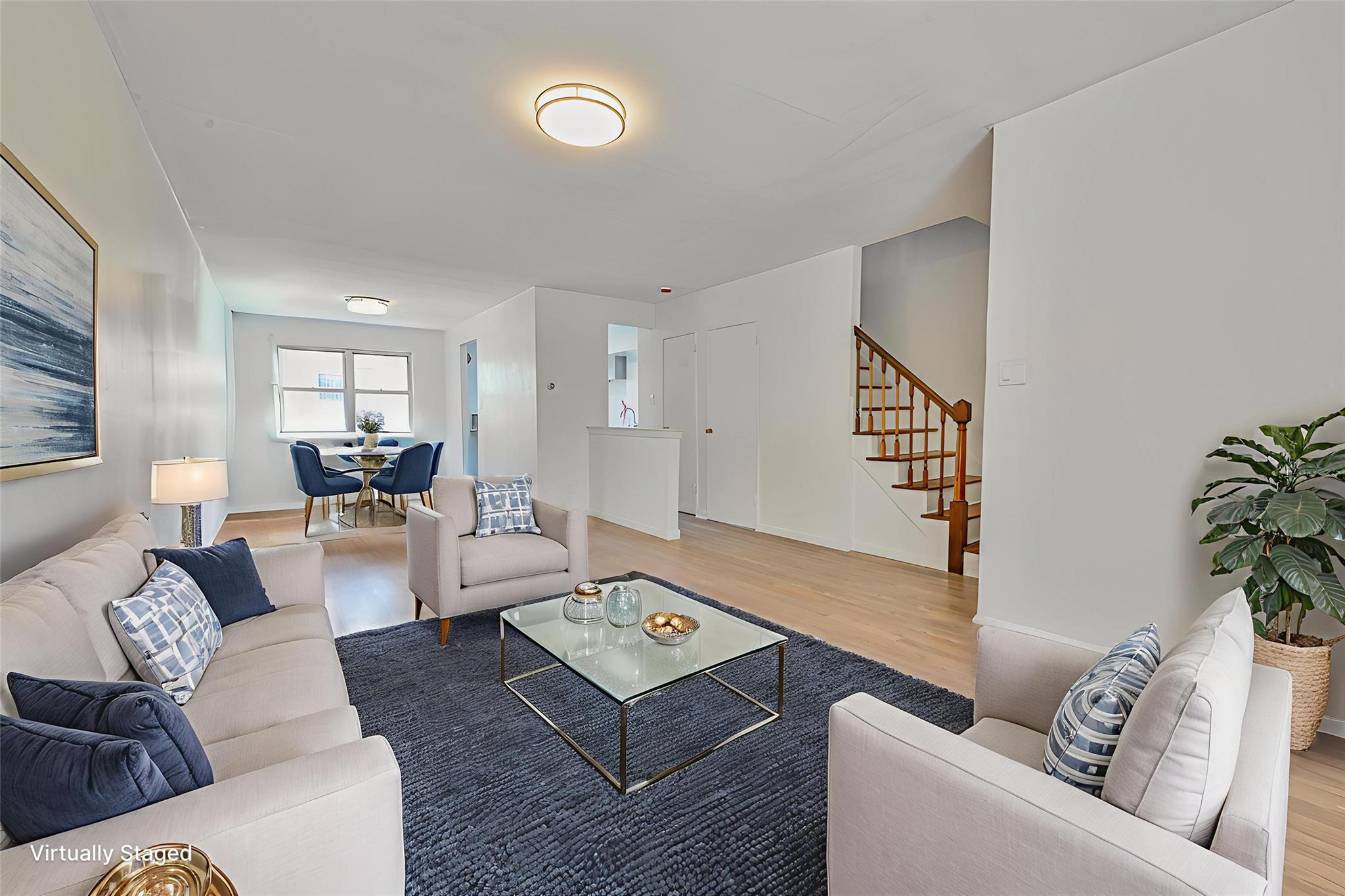 150-01 Horace Harding Expressway Queens, NY 11367 - Photo 5 of 17 Living area with light wood-type flooring and stairway