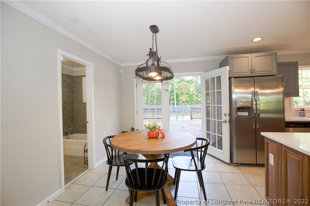 321 Pinecrest Court Road Aberdeen, NC 28315 - Photo 16 of 50 a dining room with furniture and window