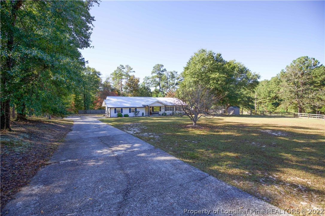 321 Pinecrest Court Road Aberdeen, NC 28315 - Photo 5 of 50 a view of a park with large trees