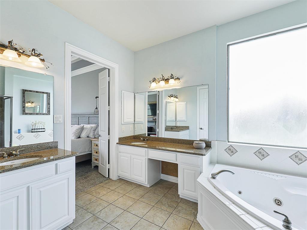 671 Countryside Drive Fairview, TX 75069 - Photo 16 of 32 a large white bathroom with a bathtub sink and toilet
