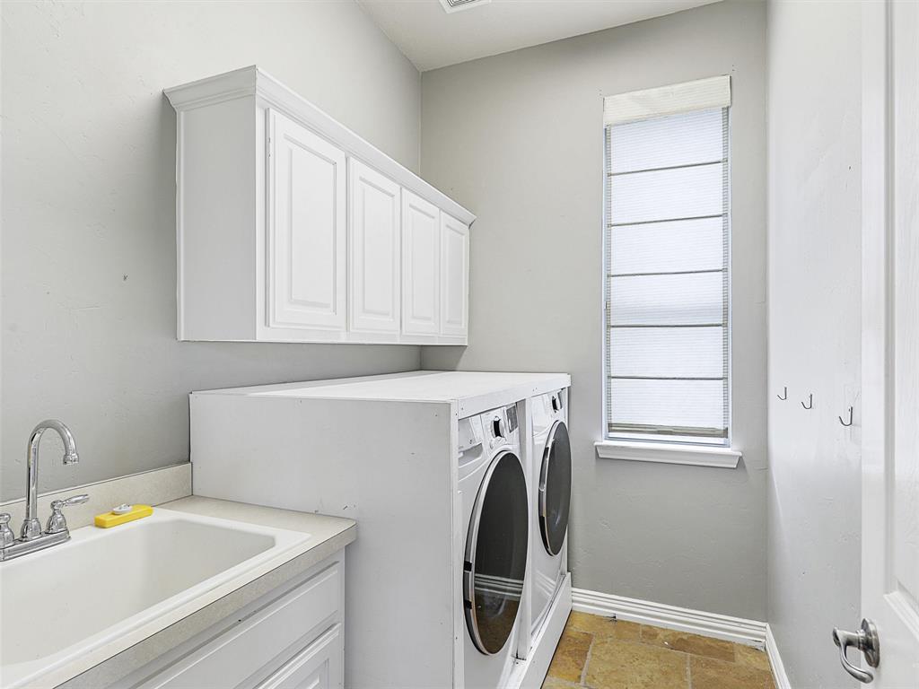 671 Countryside Drive Fairview, TX 75069 - Photo 17 of 32 a utility room with dryer and washer