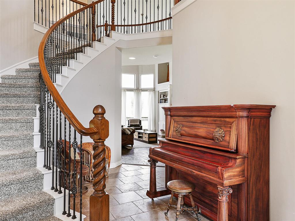 671 Countryside Drive Fairview, TX 75069 - Photo 19 of 32 a view of entryway livingroom and hall with wooden floor