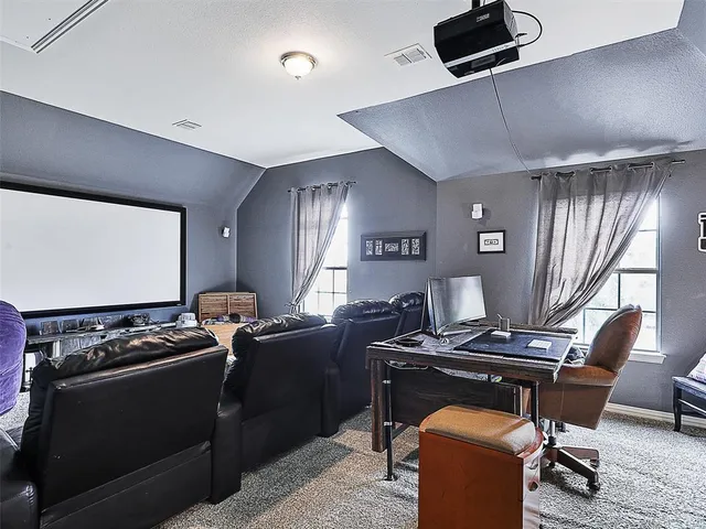 a kitchen that has a stove and a chair