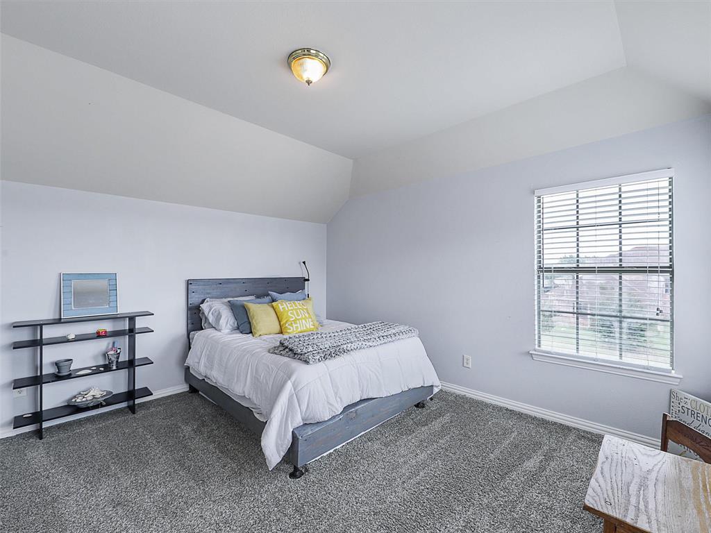 671 Countryside Drive Fairview, TX 75069 - Photo 25 of 32 a bed room with a bed and a window