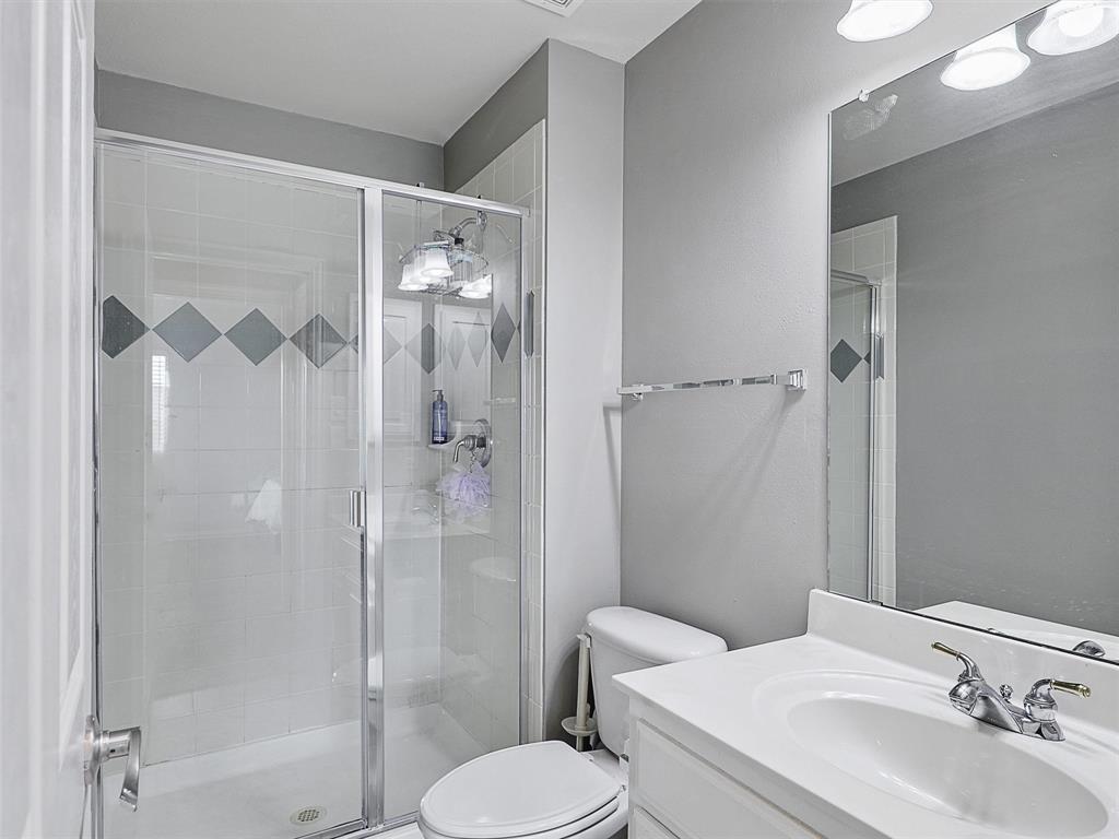 671 Countryside Drive Fairview, TX 75069 - Photo 26 of 32 a bathroom with a sink toilet and shower