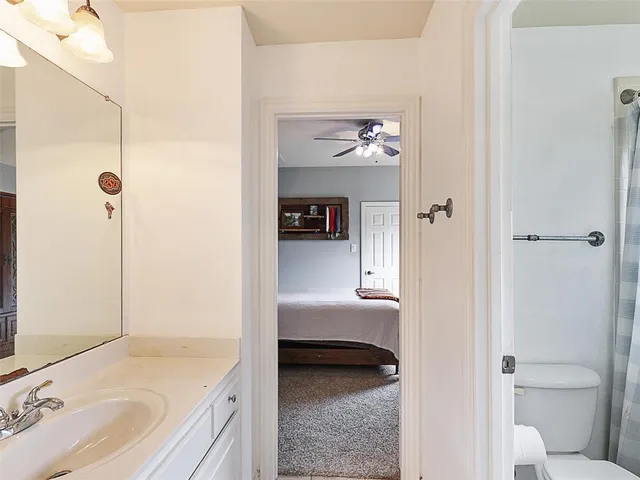 a en suite bathroom with a sink and a mirror