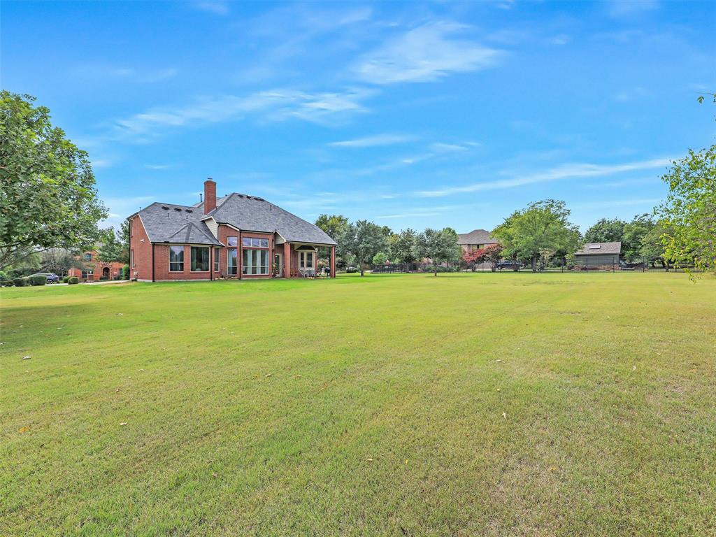 671 Countryside Drive Fairview, TX 75069 - Photo 30 of 32 a view of a house with a big yard